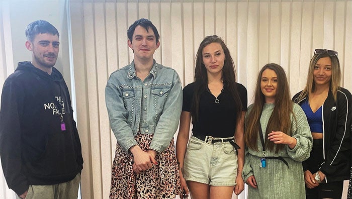 A group of young people posing for the camera