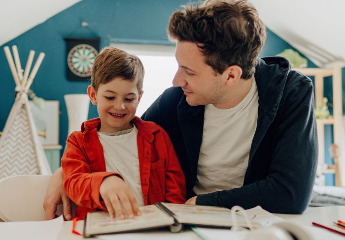 A father home-schooling a young child