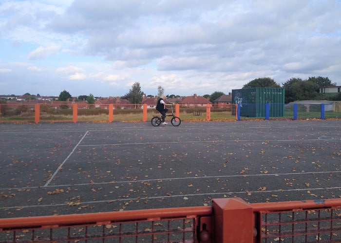 A person on a bike in a playground