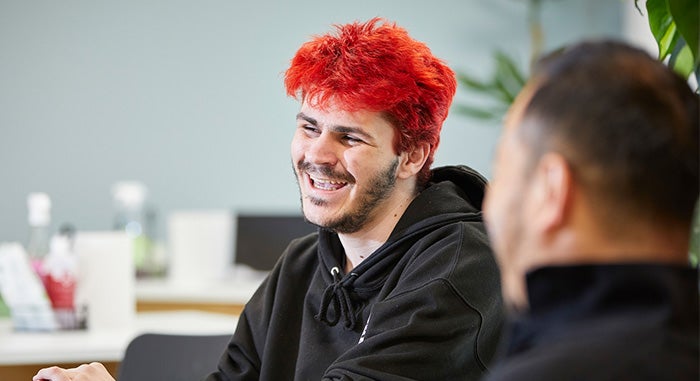 Sovereign employee with red hair laughing