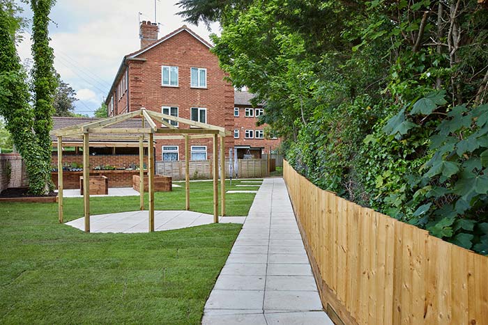 Well tended garden with a newly constructed pergola