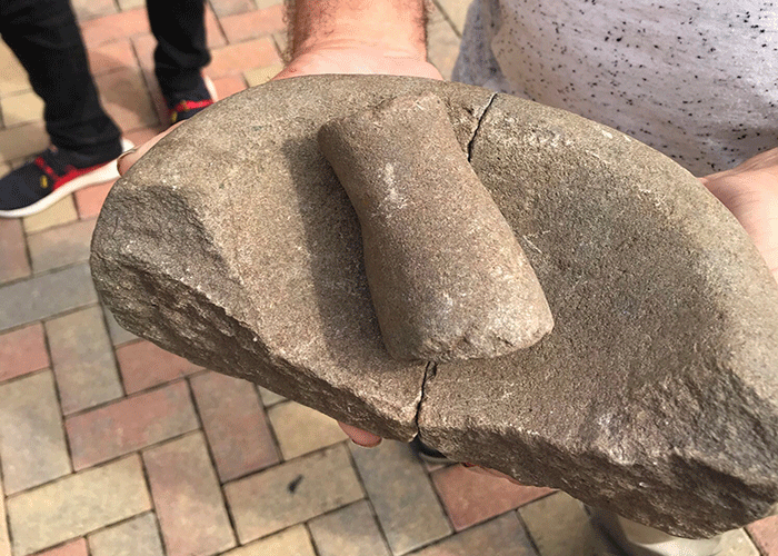 Steve England holds a piece of mortar from the Roman ruins