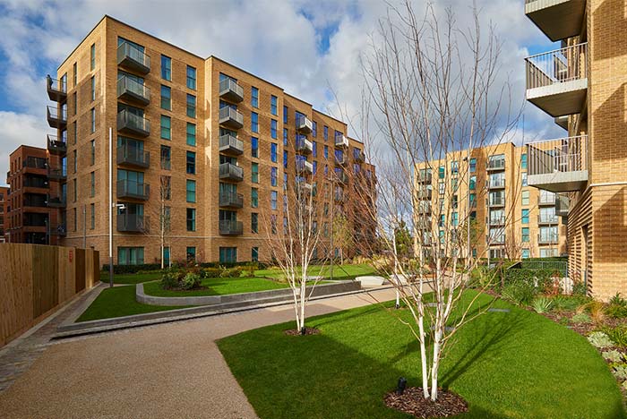 Modern blocks of flats with balconies overlooking a communal garden