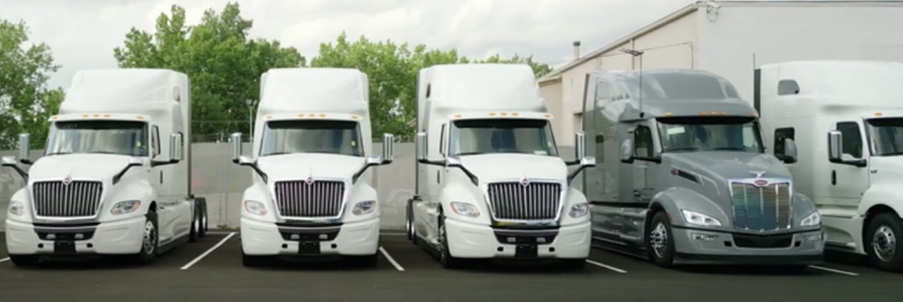 Several trucks protected by PPG coatings in a row