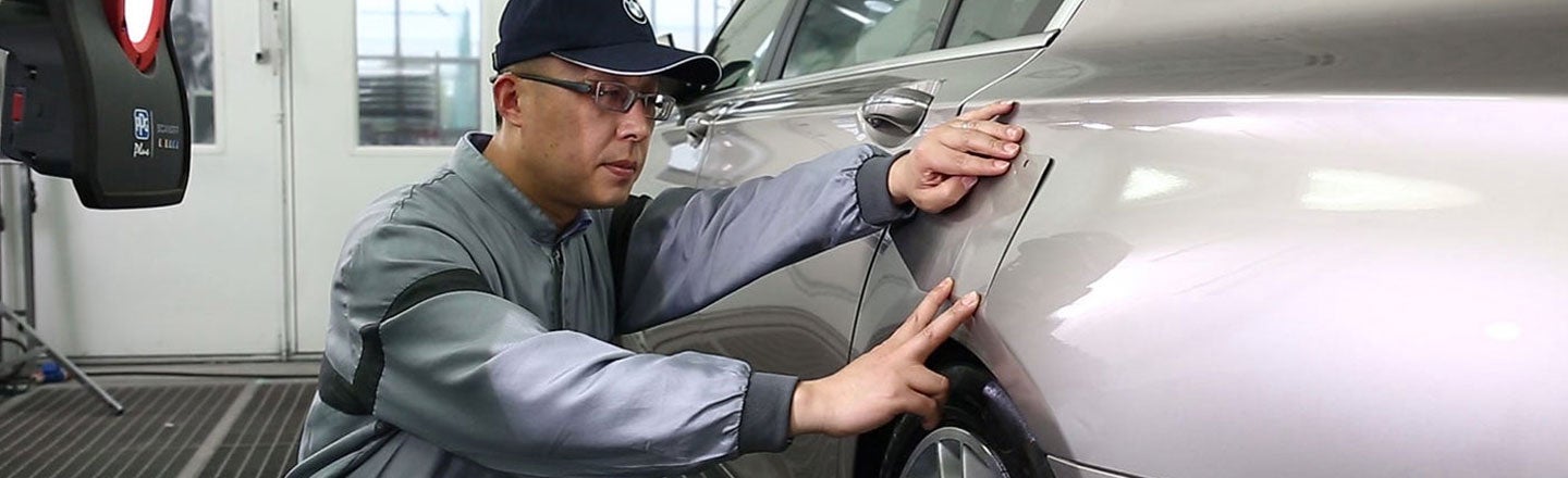 man looking at car finish 