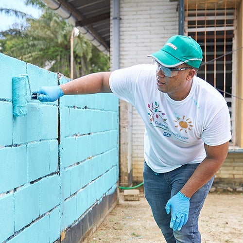 man painting wall