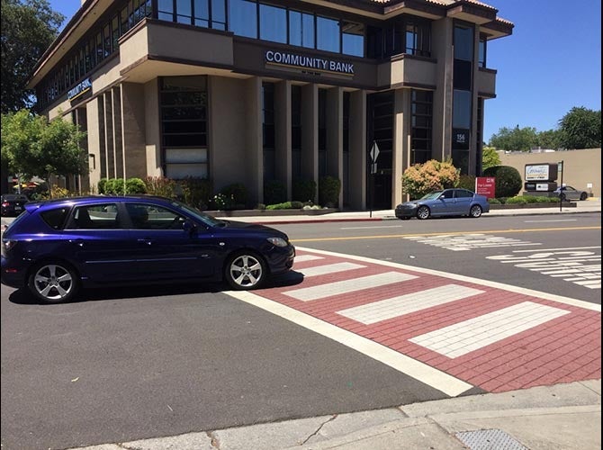 Red and white crosswalk pattern.