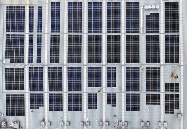 Large industrial unit roof covered with solar panels