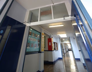 Hallway extending out from a room.