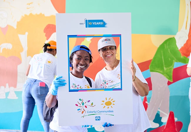 Two PPG volunteers smiling as part of Colorful Communities
