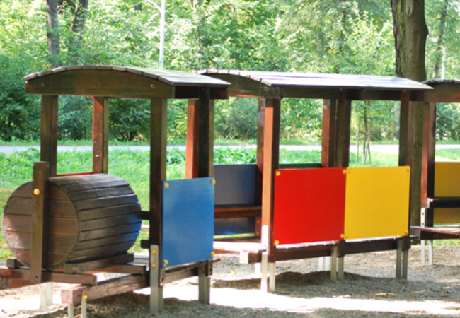 Colorful painted wooden train playground in Cieszyn, Poland 