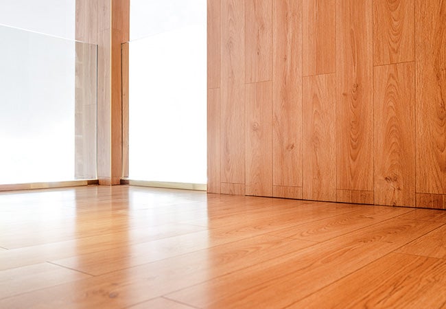 Light wood effect laminate panels for floor and wall coverage