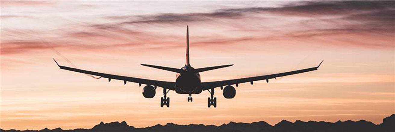 Aircraft taking off from airport. PPG provides products to maintain the life of an aircraft.