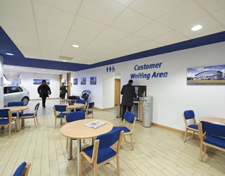 A room with blue chairs and tables
