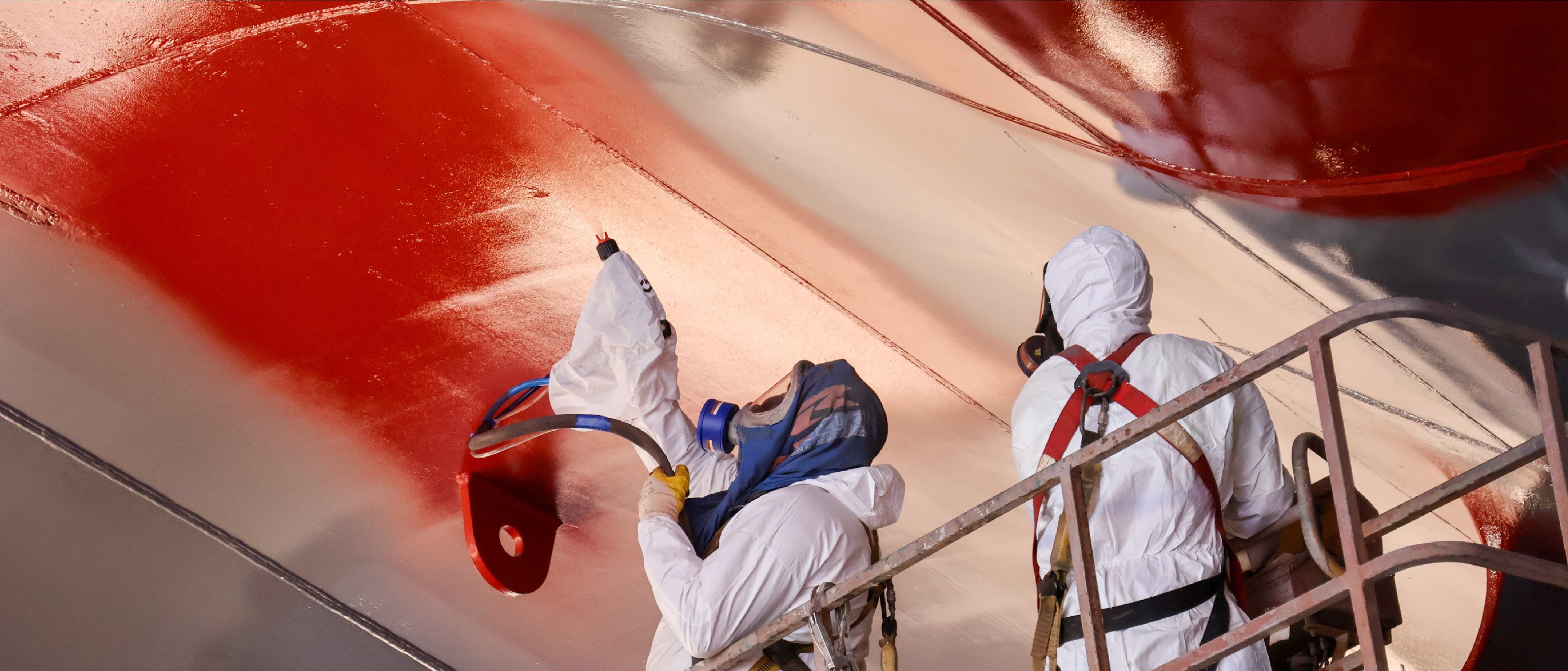 Electrostatic spray application for marine hull coatings improves transfer efficiency, cuts overspray and waste, enhances workplace safety and helps shipyards meet sustainability and cost‑reduction goals.