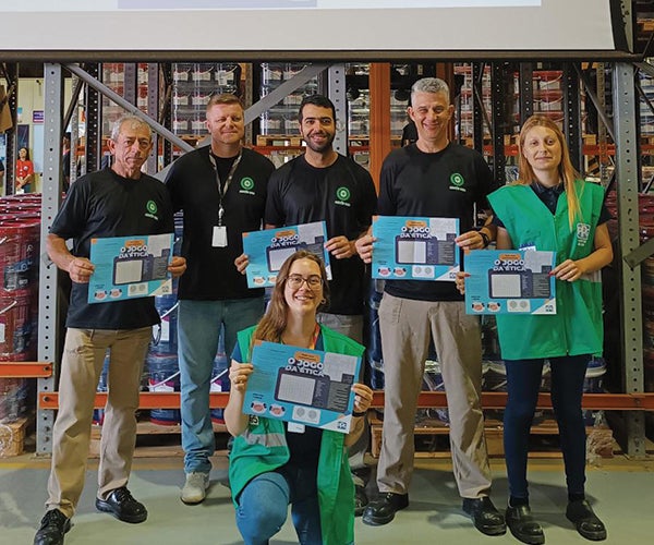 Group of wellness award winners holding certificates