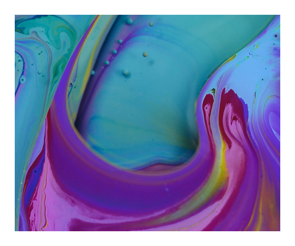 A close up of a colorful liquid
