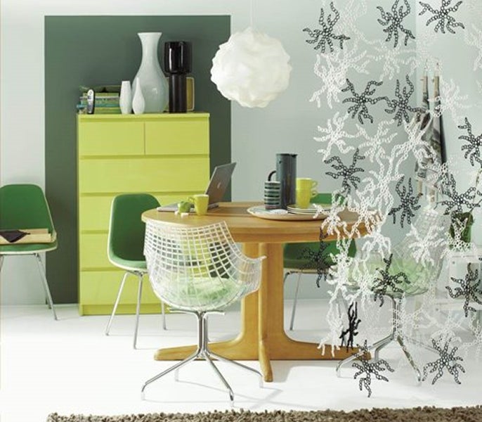 A room with a table and chairs