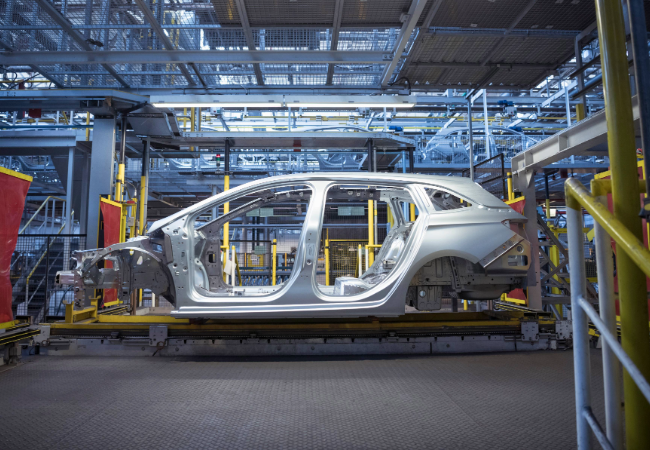 Automotive assembly plant with body in white ready for pre-treatment.