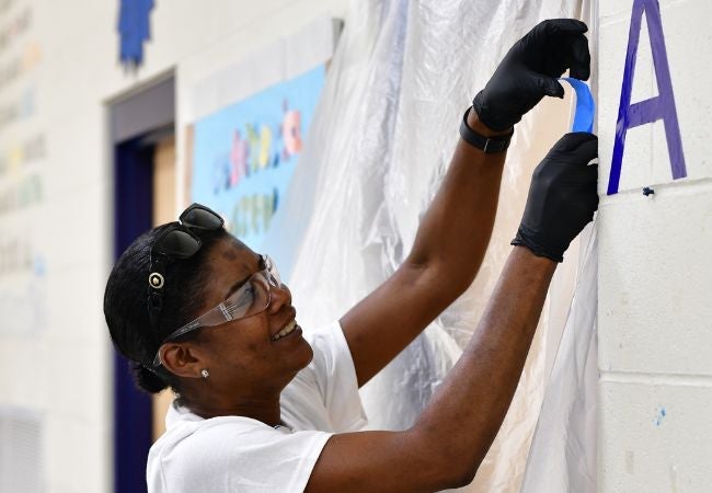 Volunteer painting in Little Rock