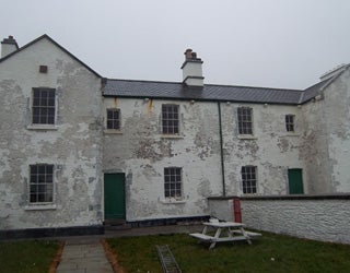 A white building with a picnic table