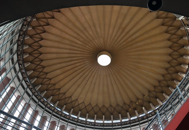 A circular ceiling with a light in the middle
