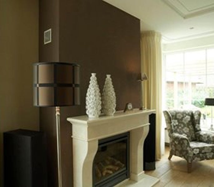 A living room with a fireplace and a couch