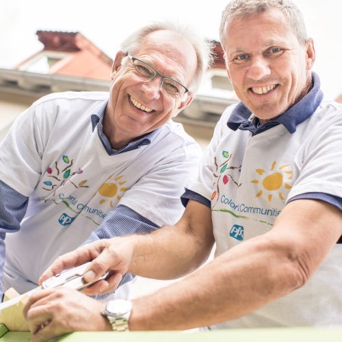 two volunteers working on a project 