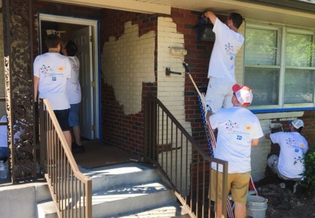 volunteers painting exterior