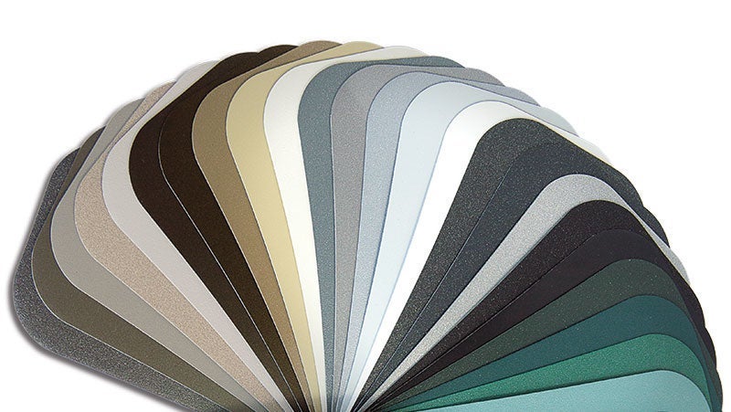 A fan of color swatches displaying a gradient of shades from white to black, including grays and greens