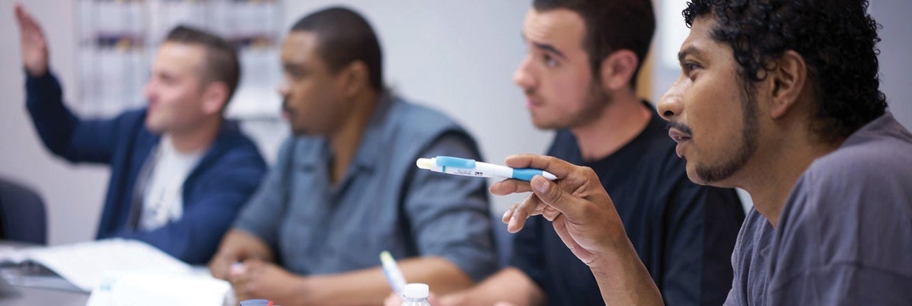 PPG employees discussing during meeting