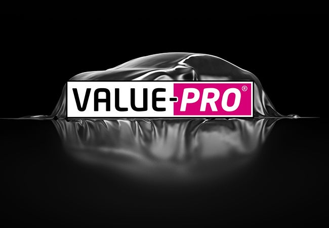 The Value Pro range signature image, the logo and a car under a cover ready for presentation