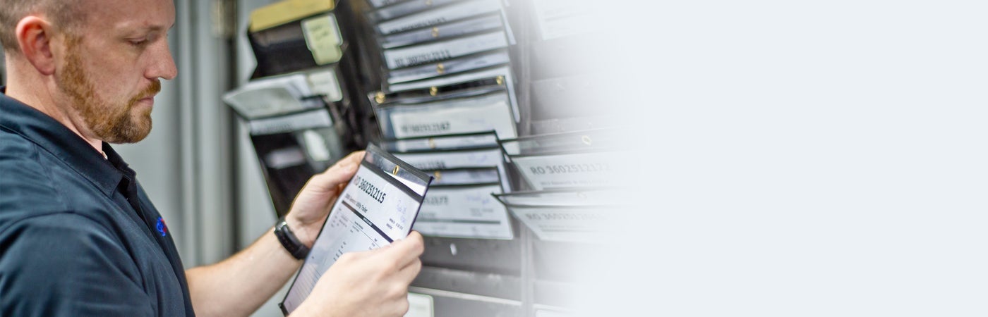 Worker inspecting documentation