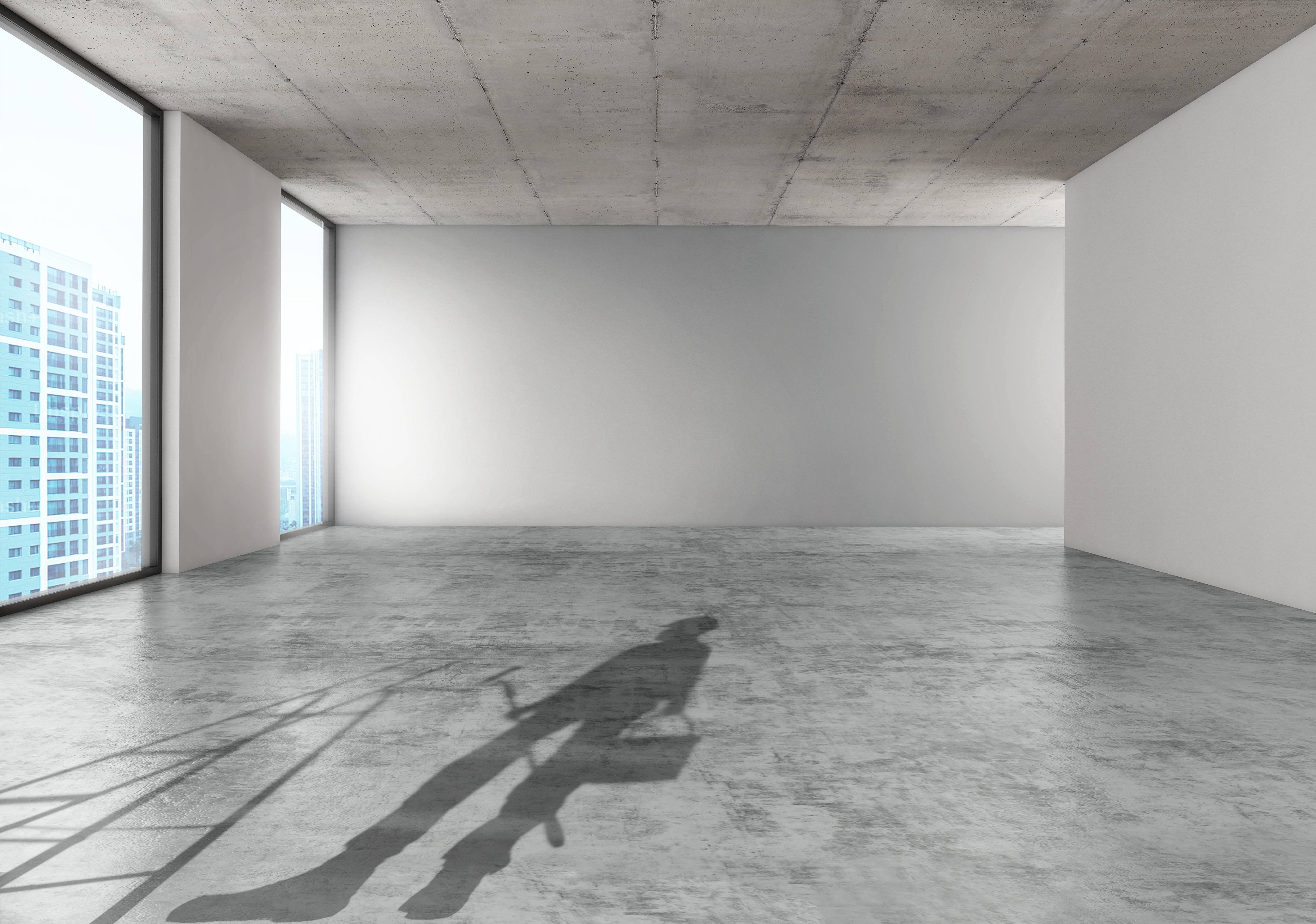 A shadow of a person on a chair in a room