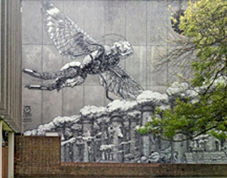 A wall with a mural depicting a flying creature.