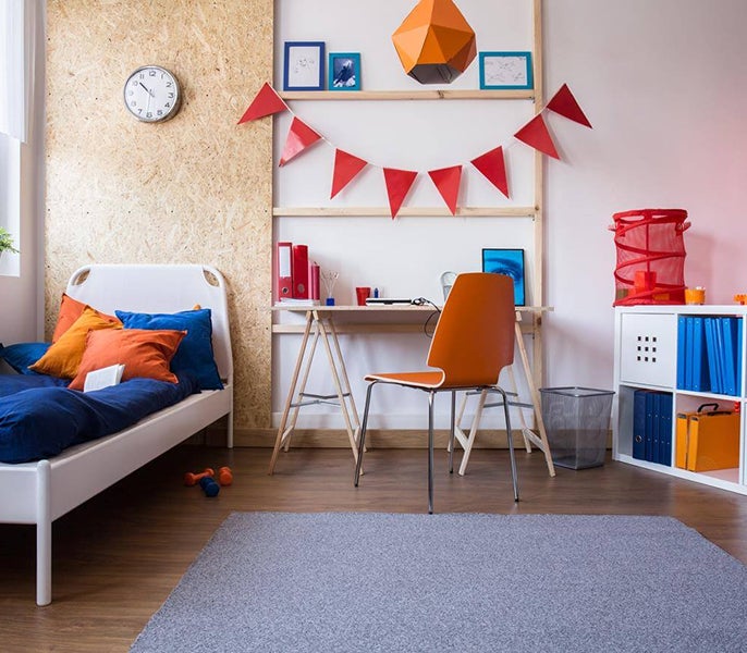 A room with a bed and desk