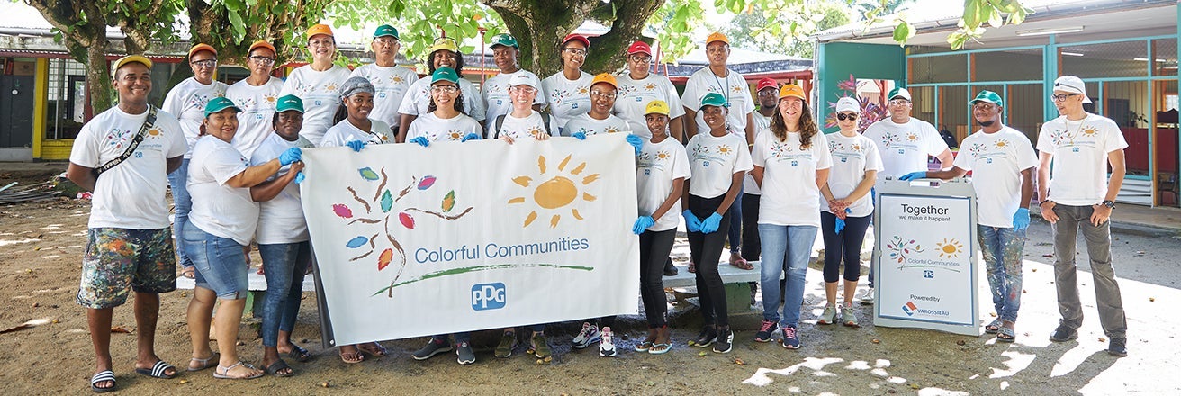 Volunteers gathered with PPG Colorful Communities sign 