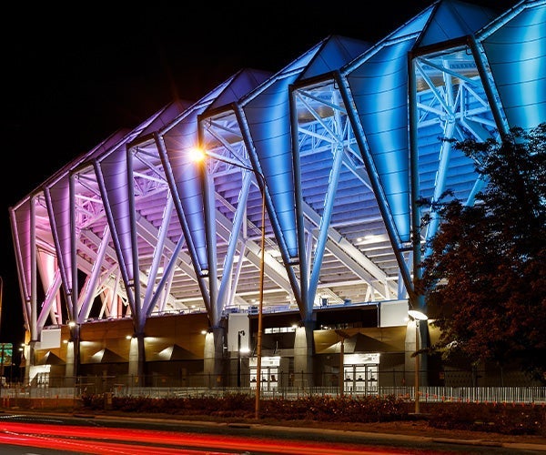 A stadium with blue and pink lights