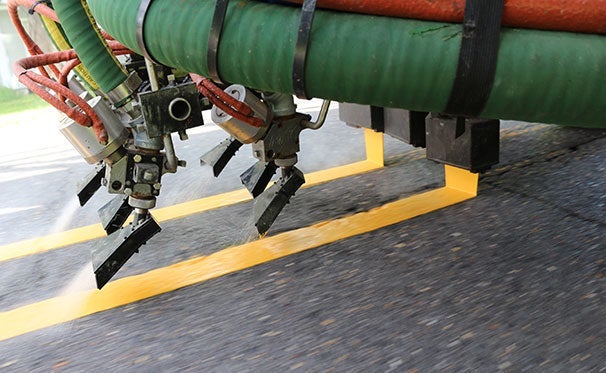 Truck applying traffic paint