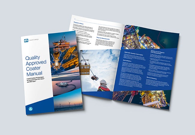 QAC manual against a plain background displaying the front cover and internal page spread