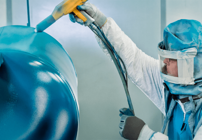 Man spraying powder coatings