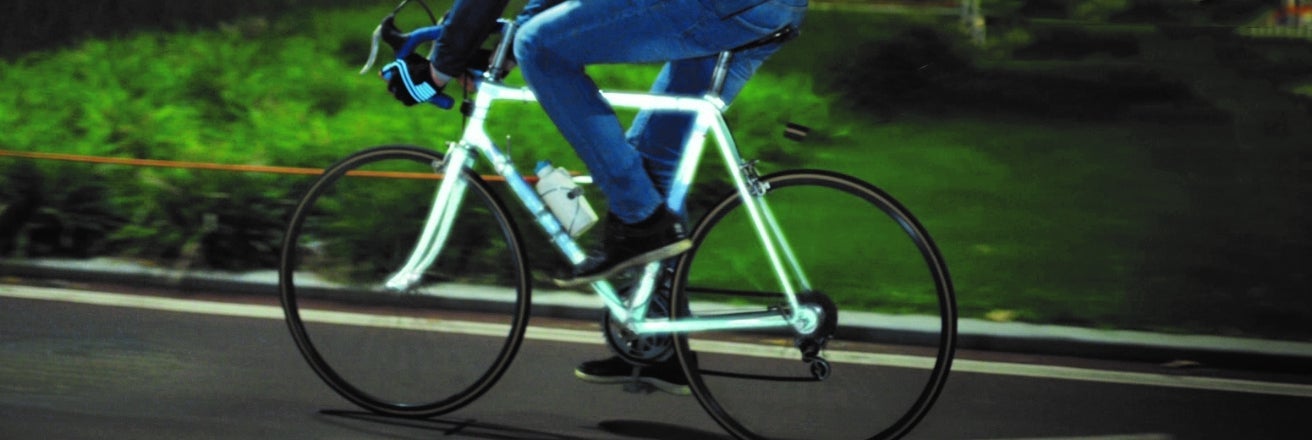 Retroreflective powder, on a bike reflecting maximum light back to its source for improved visibility at night and in low light conditions.