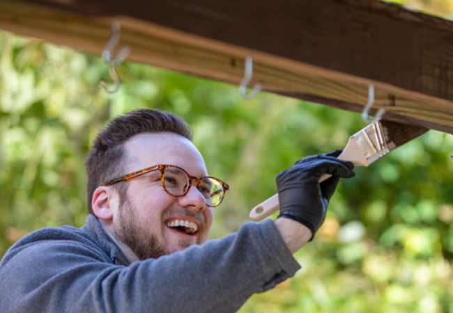 man staining wood darker color in Pittsburgh Pa