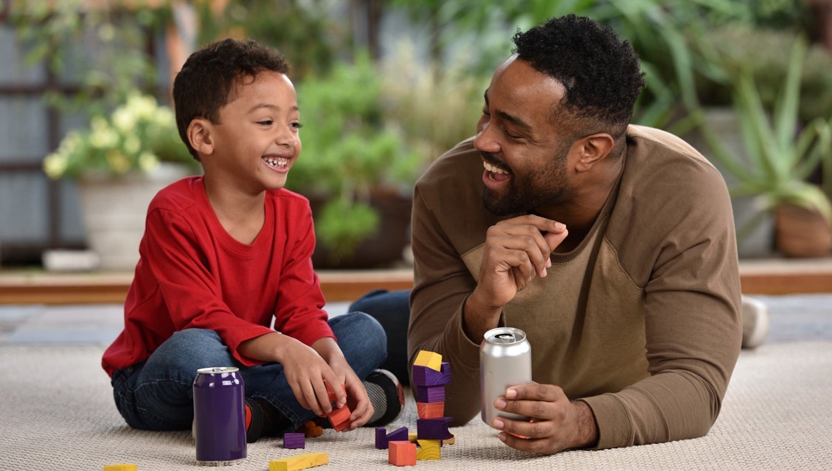 father and son laughing and playing 