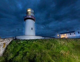 A lighthouse on a hill