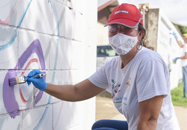 girl painting mural 