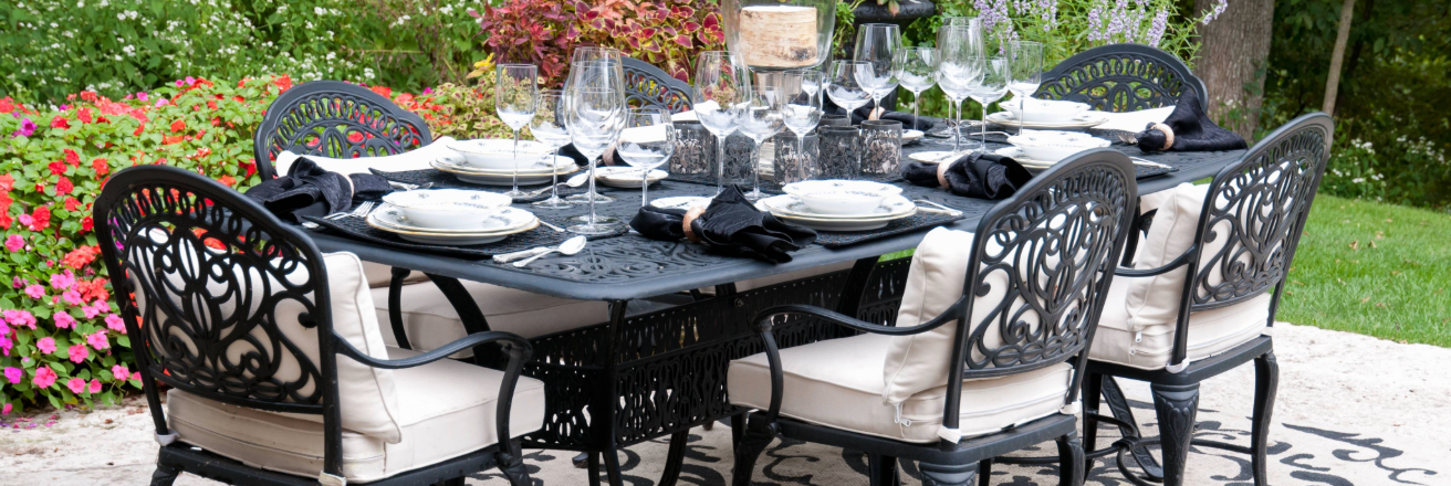 Black metal patio furniture table and chairs in outdoor setting