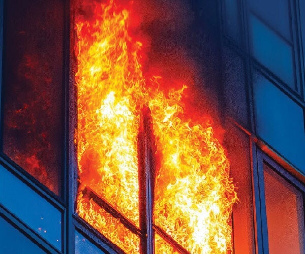 A building on fire with windows