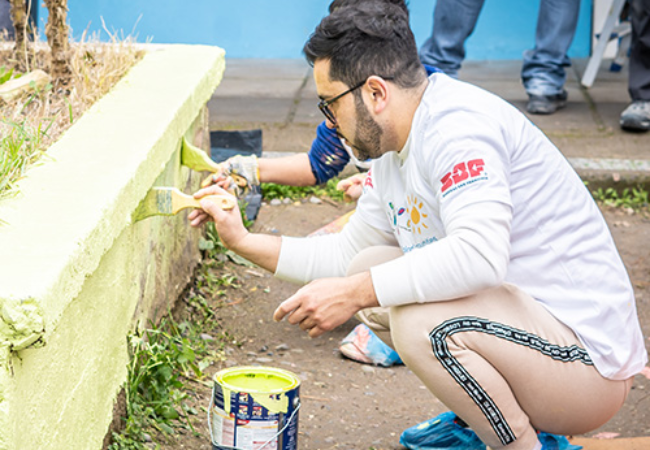 men painting wall green in Santiago, Chile 