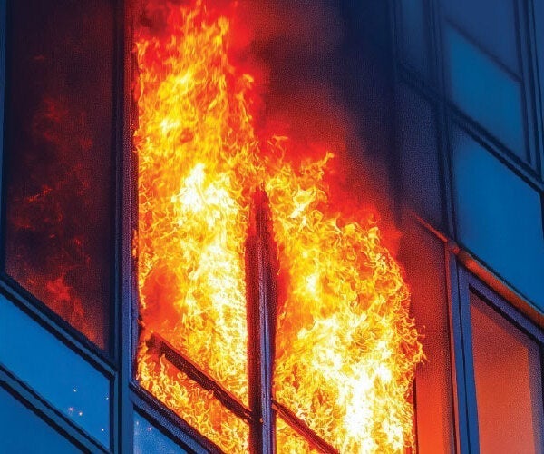 A building on fire with windows